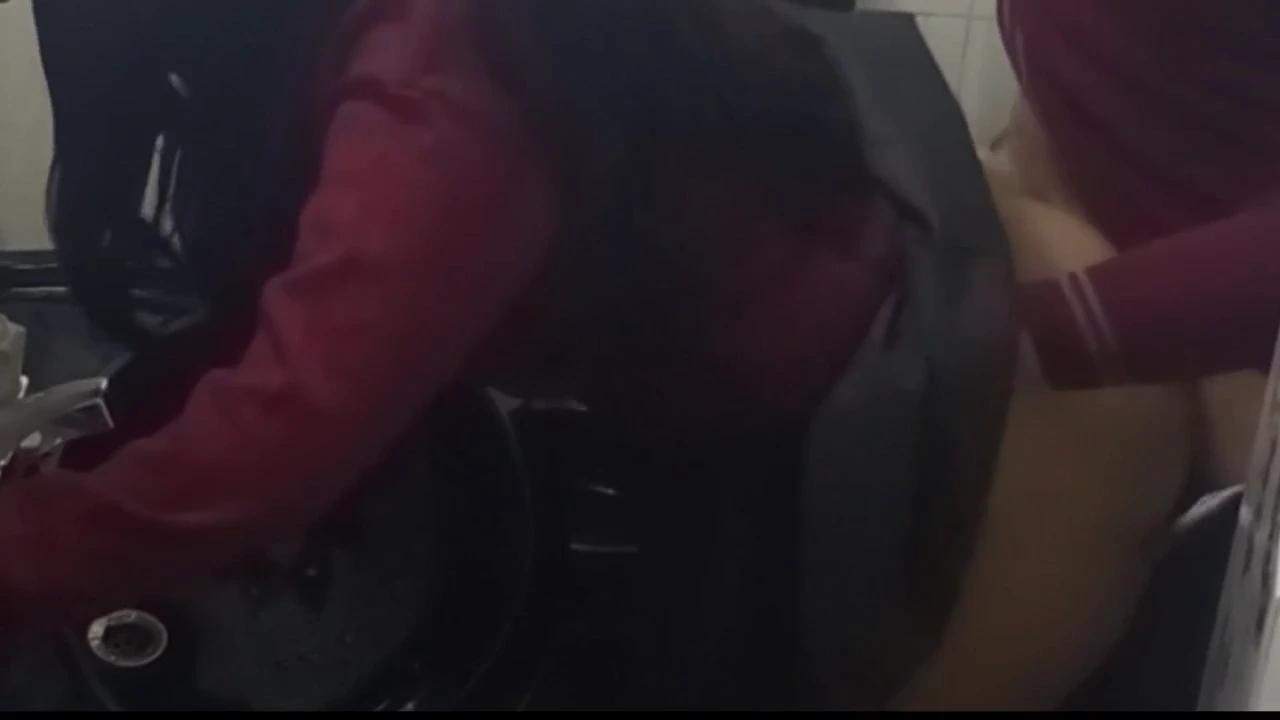 Hidden camera captures intimate moments in a college restroom porn video